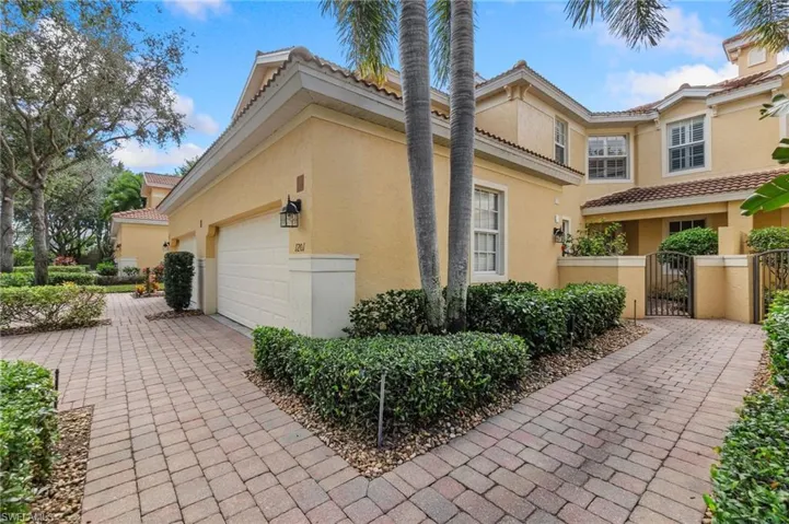 View of property exterior with a garage