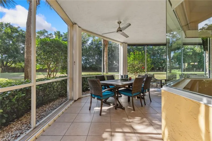 Sunroom / solarium featuring ceiling fan