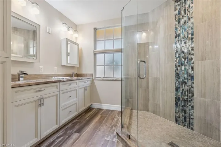 Bathroom with vanity and walk in shower