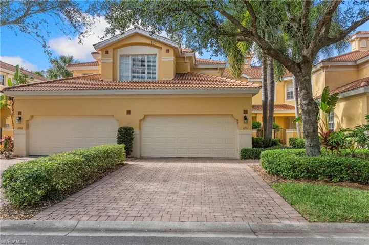 Mediterranean / spanish-style house with a garage