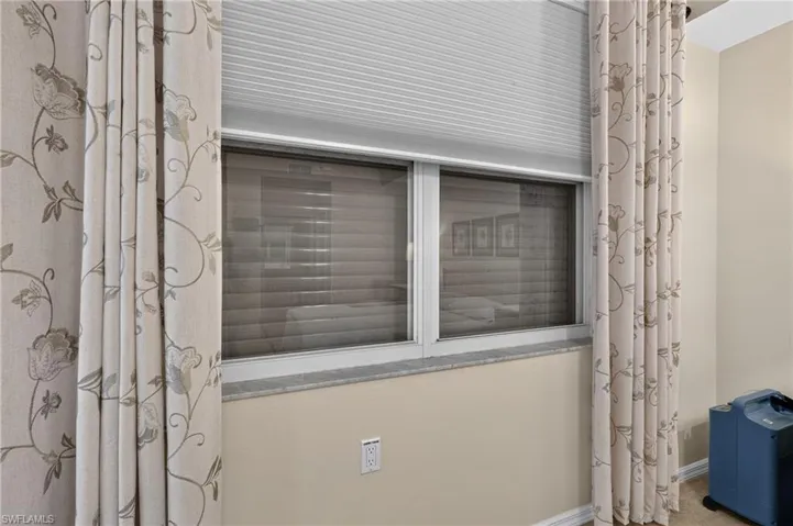 Electric Hurricane Shutter on Primary Bedroom Window.