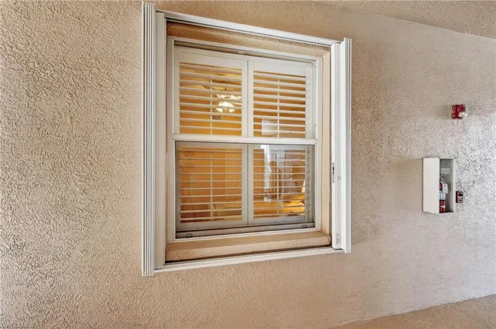 Accordian Hurricane Shutters on front windows and lanai.