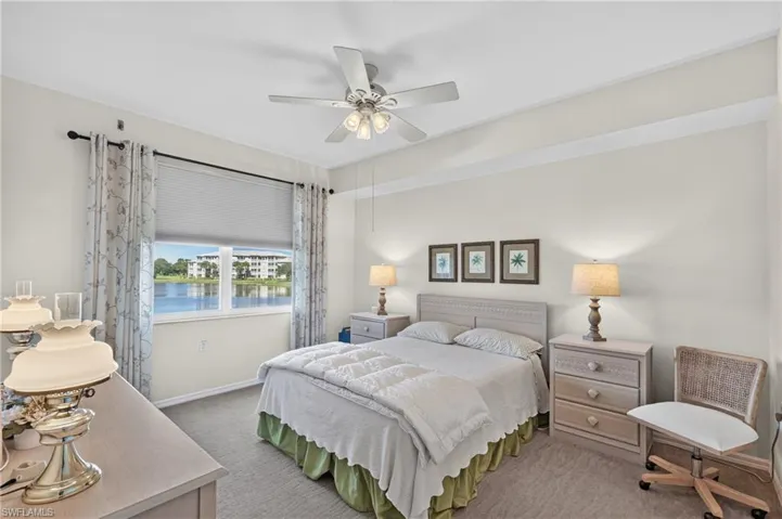 Primary Bedroom with Wonderful Lake Views and Electric Hurricane Shutter.
