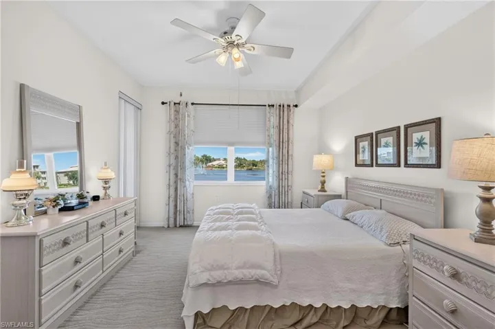 Primary Bedroom with sliding glass door to Screened Lanai