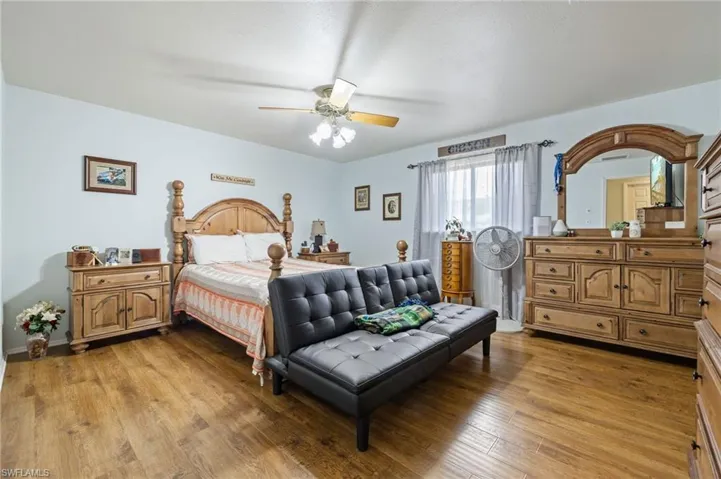 Main Bedroom with light wood-style floors and ceiling fan