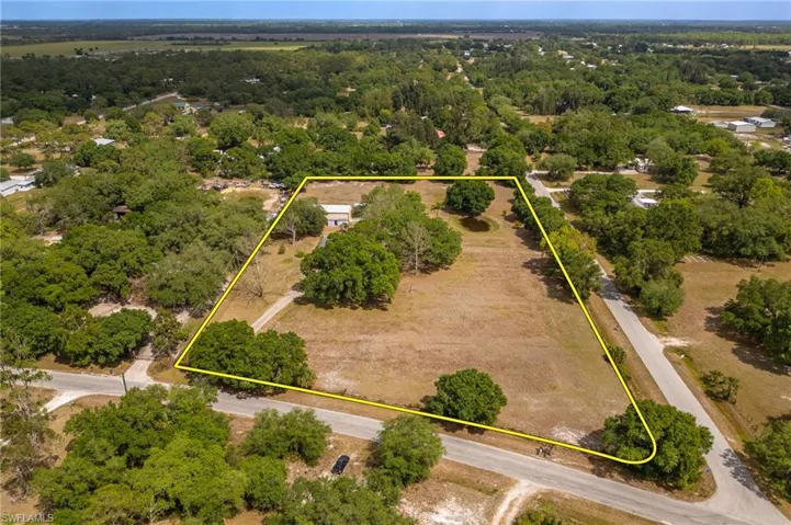 Aerial view featuring a view of trees