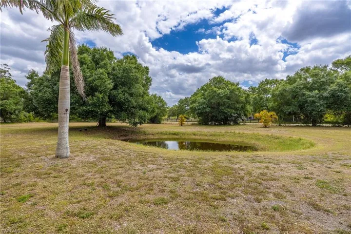 View of yard with a water view
