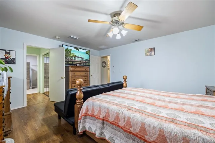 Main Bedroom featuring visible vents, wood finished floors, and ceiling fan