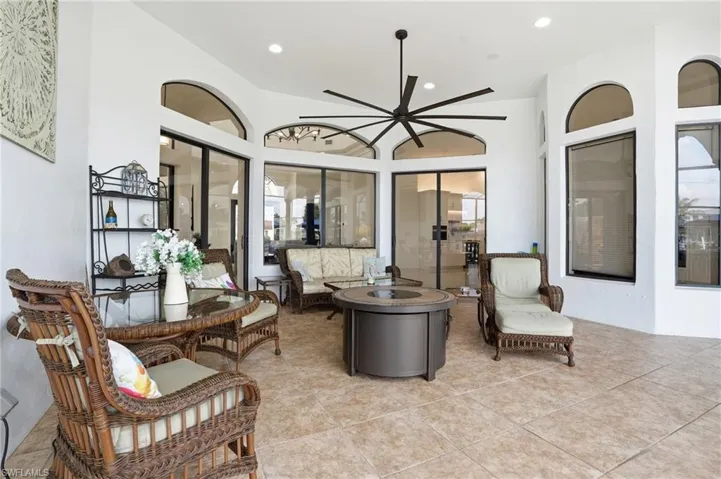 Living room featuring a ceiling fan and recessed lighting