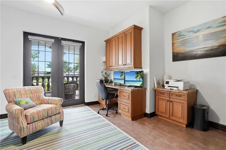Office area featuring french doors and light wood-style flooring