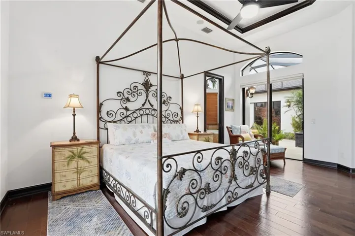 Bedroom featuring dark wood finished floors and access to outside