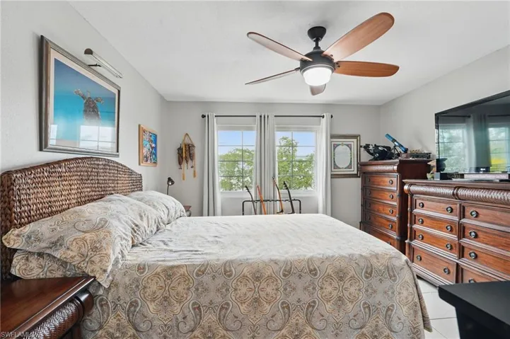 Tiled bedroom with ceiling fan