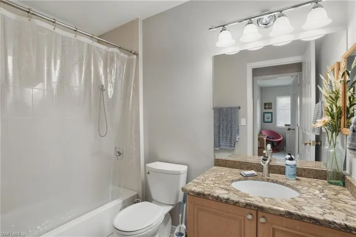 Bathroom with vanity and shower / bath combo