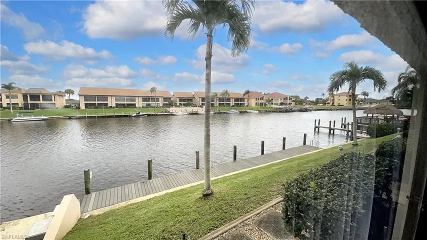 Property view of water featuring a dock