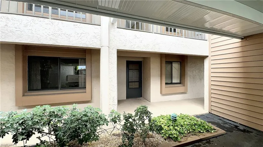 View of exterior entry featuring a balcony