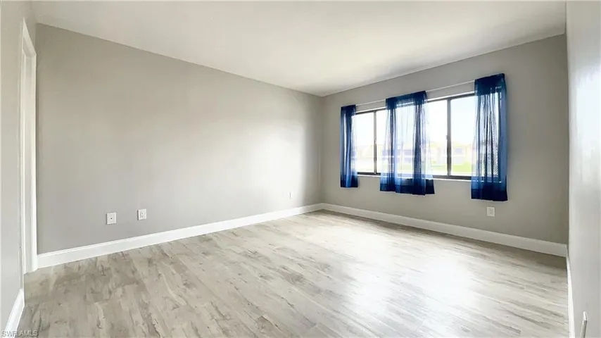 Spare room with light wood-type flooring