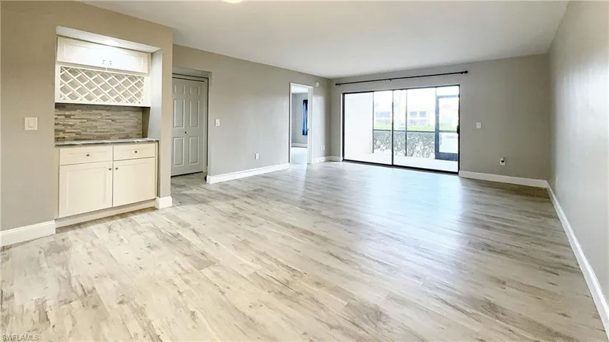 Unfurnished living room with light hardwood / wood-style flooring