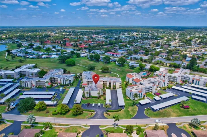 Drone / aerial view with a residential view and a water view