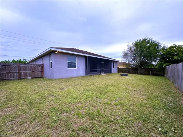 View of yard with a sunroom