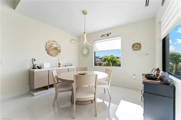 Dining room featuring light tile patterned flooring