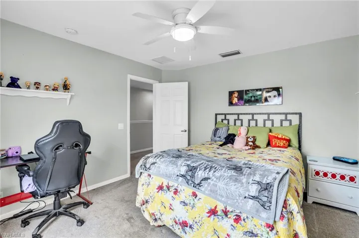 Bedroom featuring carpet flooring and ceiling fan