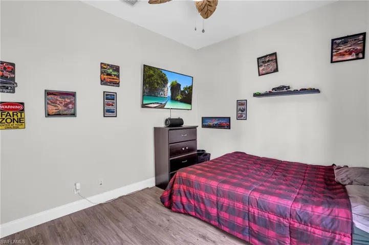 Bedroom featuring hardwood / wood-style flooring and ceiling fan