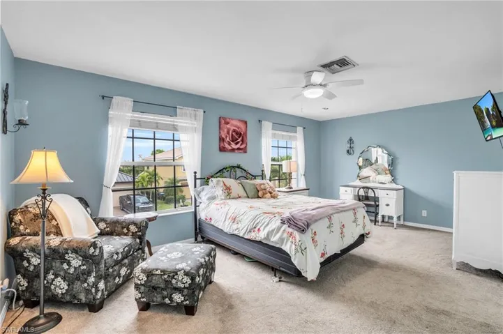 Bedroom featuring carpet floors and ceiling fan