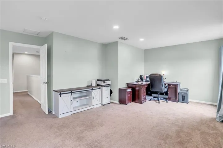 Office area featuring carpet flooring