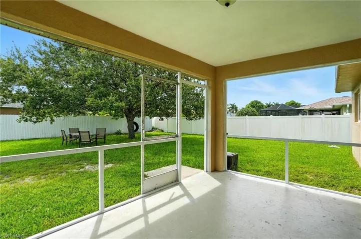 Unfurnished sunroom with a patio