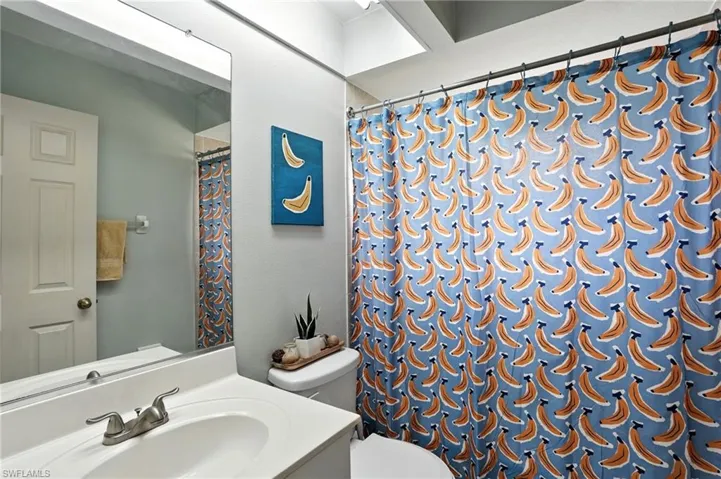 Full bath with vanity and curtained shower
