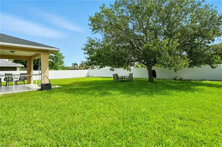 Fenced backyard featuring a patio area