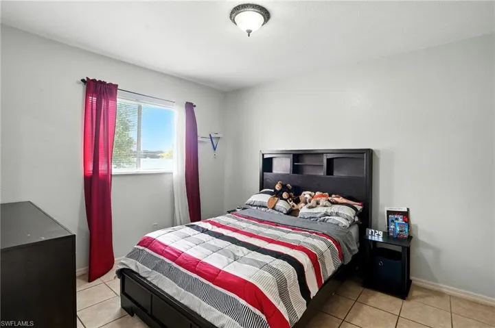 Bedroom featuring light tile patterned flooring