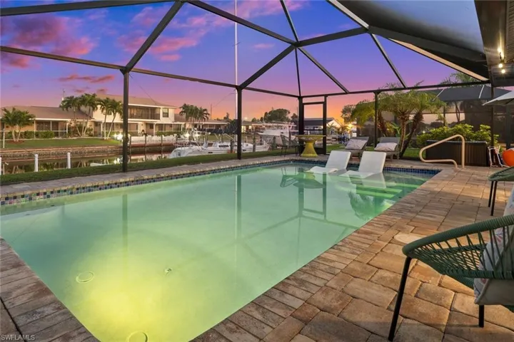 Sailboat Access canal with a newer pool and lounging sun shelf.  Home is offered turnkey with all furnishings, decor and dishware.
