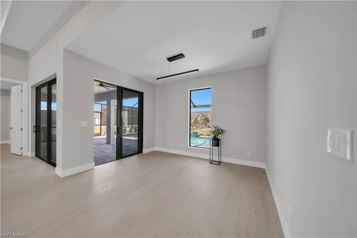 Unfurnished room with light wood-type flooring and baseboards