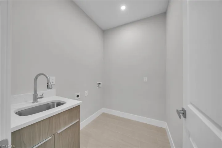 Laundry room featuring washer hookup, recessed lighting, and electric dryer hookup