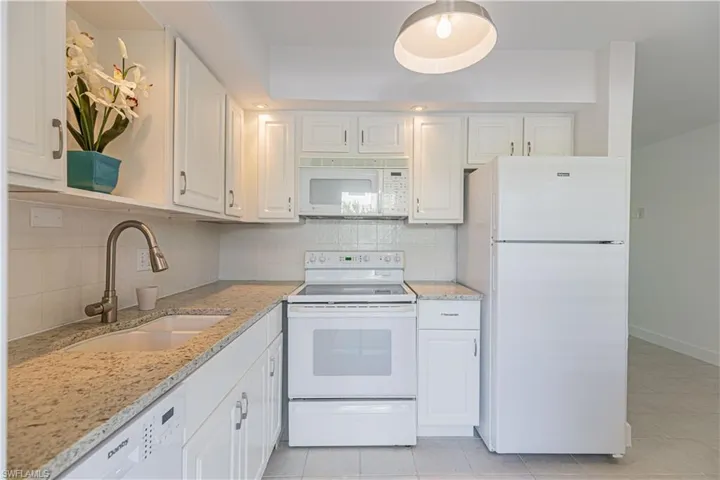 White Tile throughout entire Condo