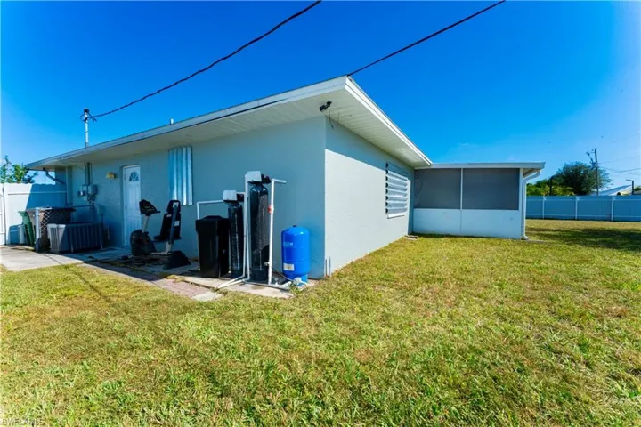 Rear view of house with stucco siding