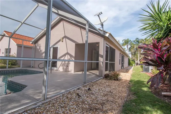 Back of the home with  screened lanai