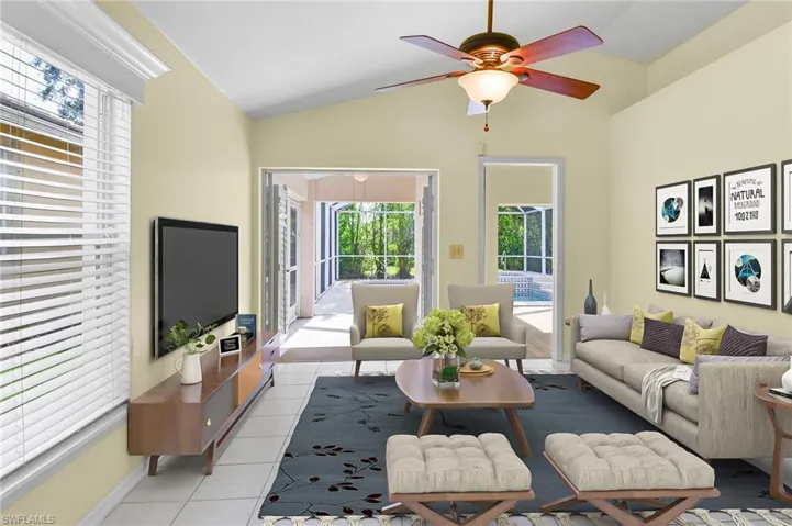 Living  Room with French doors leading to the pool area and lanai.