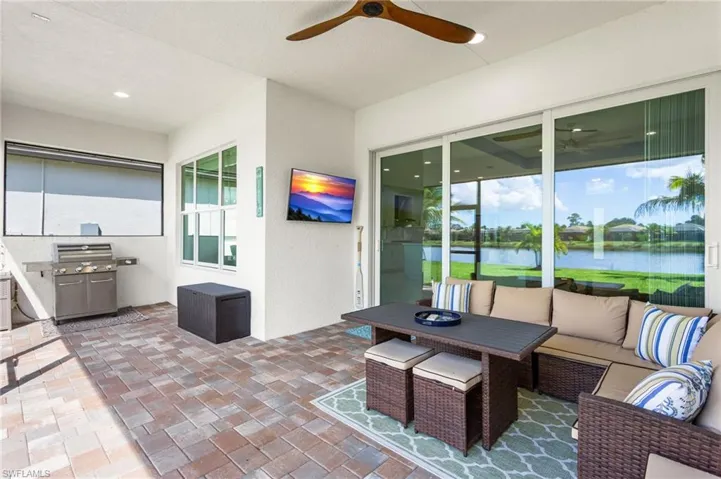 View of patio / terrace with ceiling fan, a grill, and outdoor lounge area