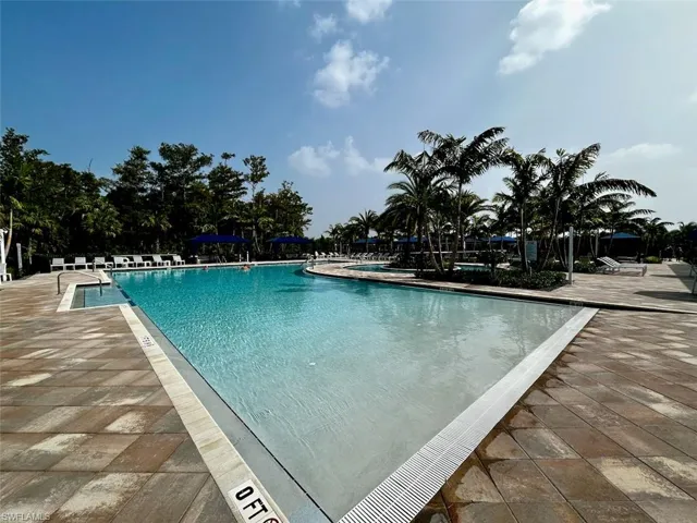 Community pool featuring a patio