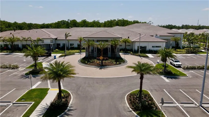 View of property with uncovered parking