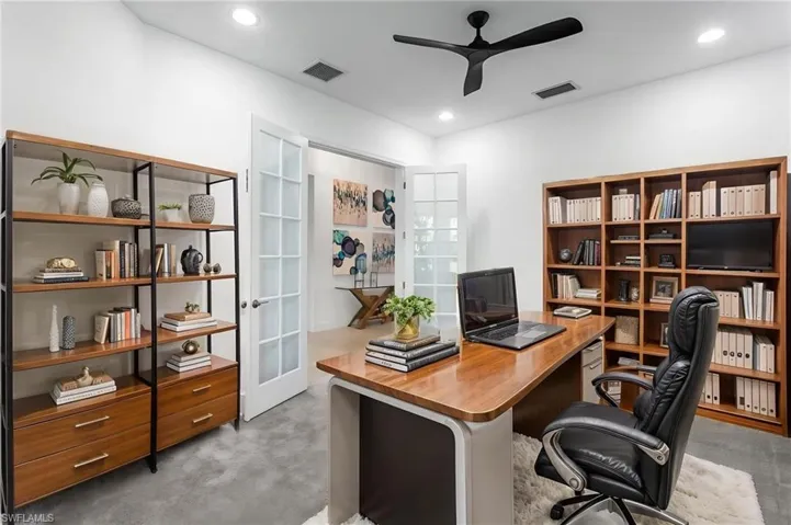 Office area with light colored carpet, a ceiling fan, french doors, and recessed lighting
