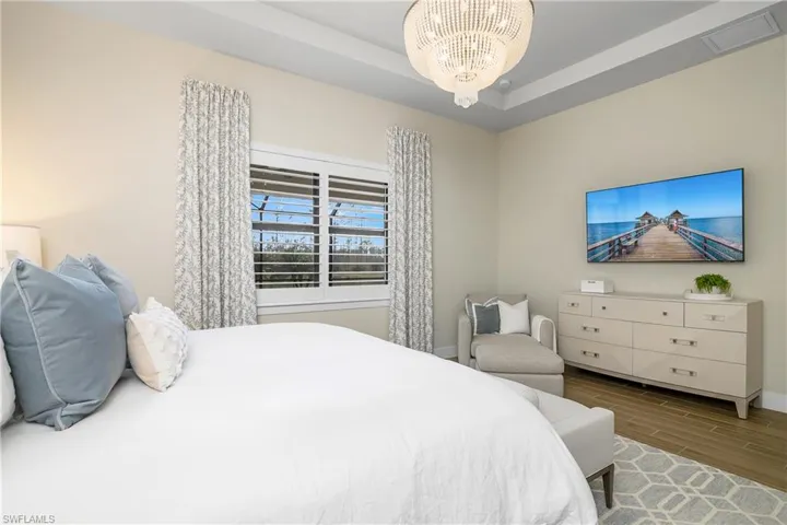 Comfortable and Cozy owner suite includes ensuite bath and huge walk-in closet with custom built-in shelving.