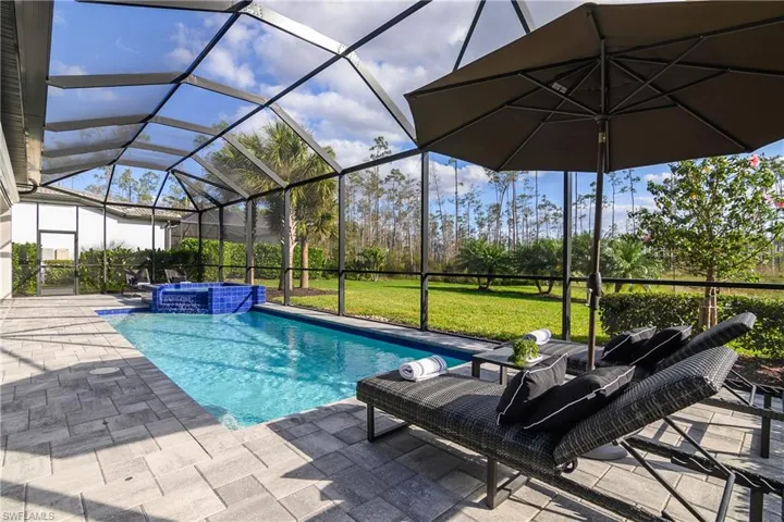 Inground pool features pool with waterfall feature at spa, and natural gas heat which is quick and economical.
