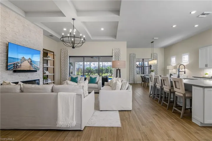 Open floor plan with high ceilings and seamless indoor/outdoor living is great for family gatherings.