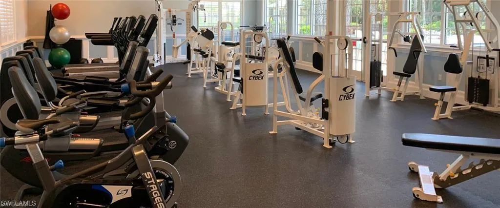 Exercise room featuring healthy amount of natural light