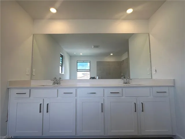 Bathroom featuring dual vanity