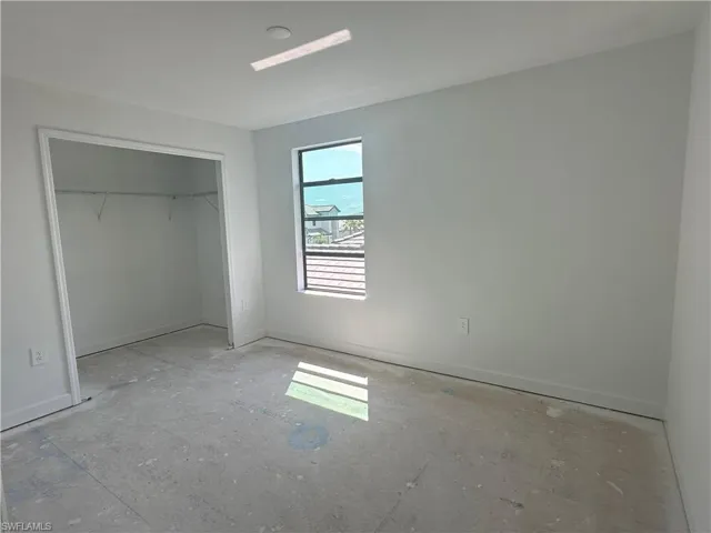 Unfurnished bedroom featuring a closet
