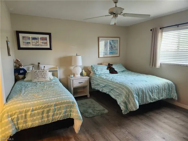 Bedroom with wood finished floors and ceiling fan